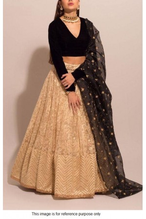 Bollywood model beige and black lehenga choli