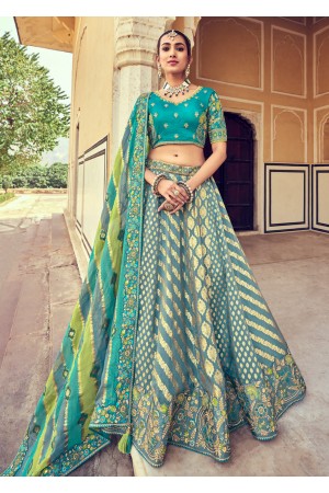 Woven Zari Banarasi silk lehenga choli in Blue and Green