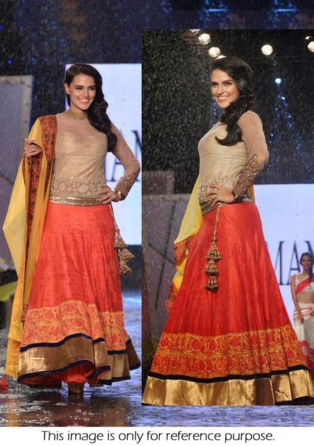 Bollywood Style Neha Dhupia velvet lehenga in orange and yellow color