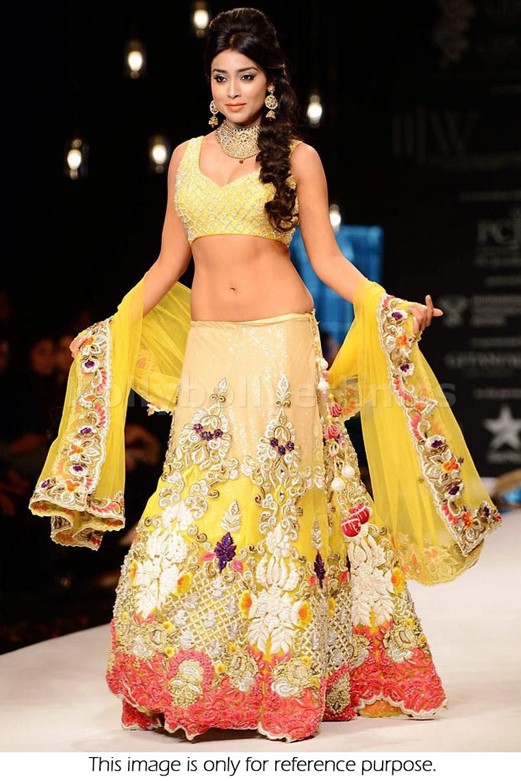 Bollywood Style Shriya Saran georgette lehenga in yellow and gold color