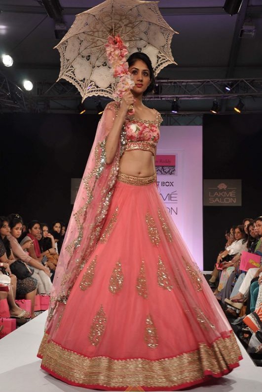 Bollywood Style Lakme fashion model net lehenga in peach color