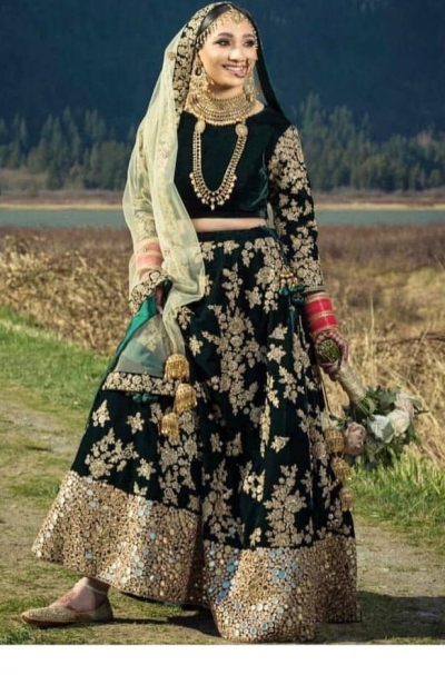 Bollywood model Dark green velvet mirror lehenga