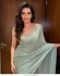 Bollywood model Karishma Tanna Pista green sequins saree