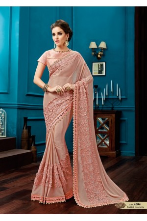 Peach knitted georgette wedding wear saree