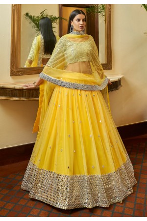 Yellow net mirror work lehenga choli 7306