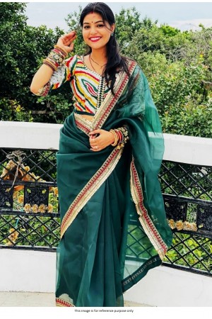 Bollywood model Teal green organza saree