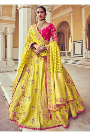 Woven Zari Banarasi silk lehenga choli in Yellow and Pink