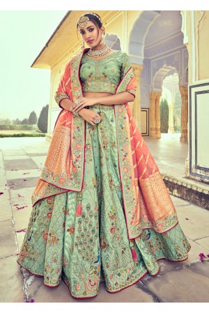 Woven Zari Banarasi silk lehenga choli in Pista Green and Peach