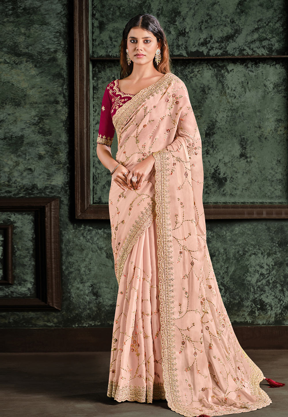 Varuni Gopen Collections - Picture yourself in this pale peach sari. The  color is light and breezy and makes you look cool and pretty. Sari is  featured in georgette with sequin embellishments