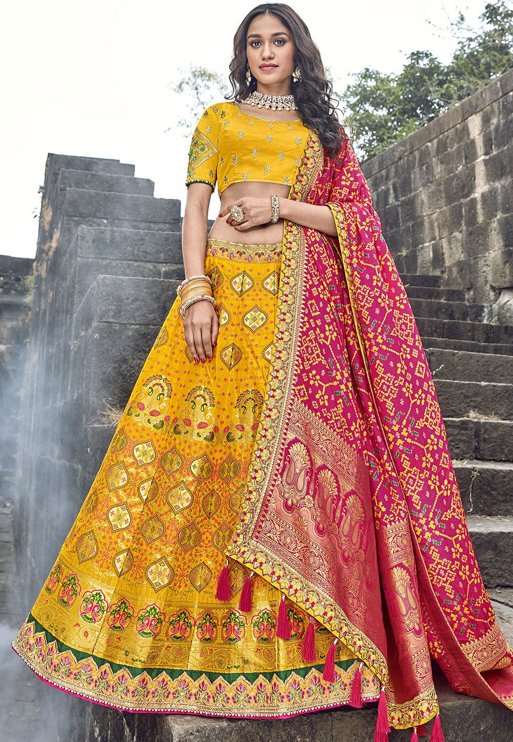 RANI PINK GOTA WORK LEHENGA SET WITH SCALLOPED HEM, NET FRILL DETAILS AND  CONTRAST YELLOW DUPATTA. - Seasons India