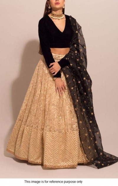 Bollywood model beige and black lehenga choli