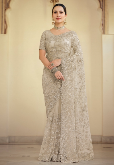 Beige net saree with blouse 7520