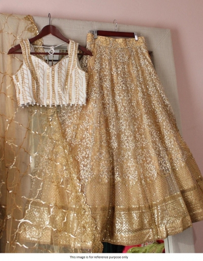 Bollywood Model Cream and gold sequins lehenga choli