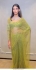 Bollywood model Parrot green net sequins saree