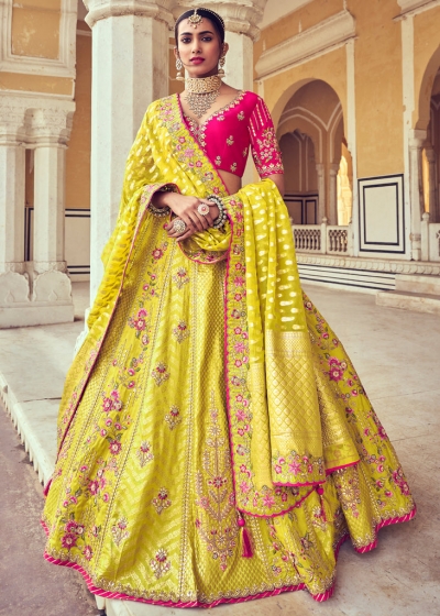 Woven Zari Banarasi silk lehenga choli in Yellow and Pink