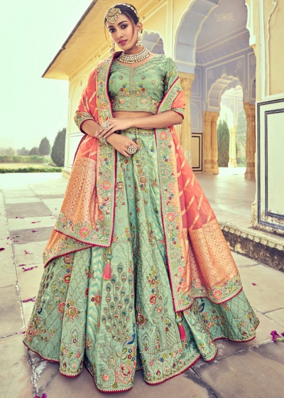 Woven Zari Banarasi silk lehenga choli in Pista Green and Peach