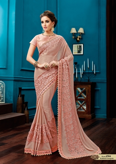 Peach knitted georgette wedding wear saree